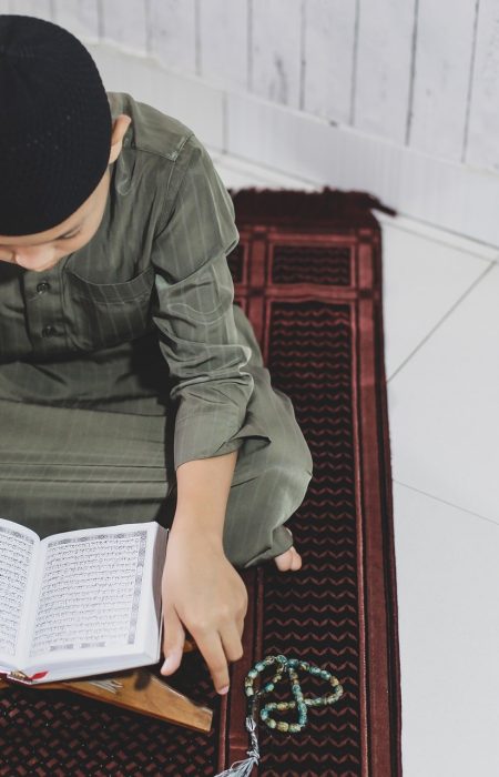 muslim-boy-reading-holy-quran-2021-08-30-06-01-29-utc-min.jpg